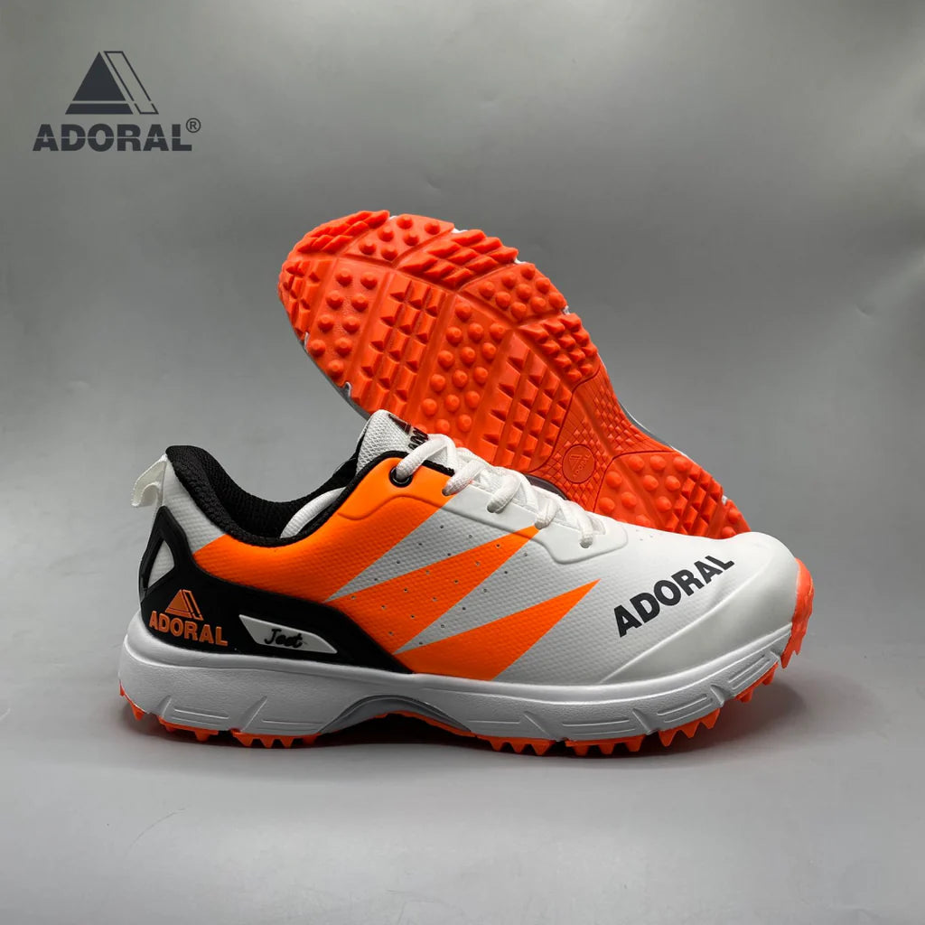 Adoral Jeet orange cricket shoes front view on white background