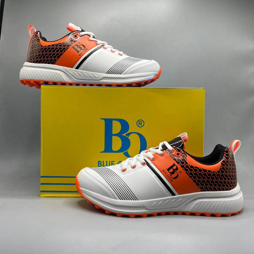 High-traction white and orange cricket gripper shoes for tape ball